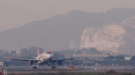 An Easyjet airplane landing at the terminal of barcelona airport in spain