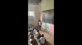 Children practice reading the syllabary in Zanzibar, Tanzania