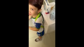 Kid shows off creative washing machine backpack in Santo Anastácio, Brazil