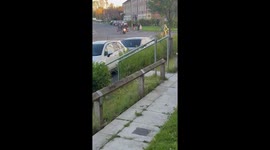 Men ride motorcycle with bench in St Helens, England, UK