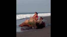 Whimsical Woman Gets Tossed by the Sea