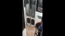 Bus Rescues Passengers Stranded By Torrential Rain