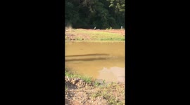 Off-road buggy powers through deep mud pits in Yunnan, China