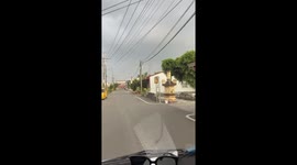 Tornado stuns motorists as it swirls above homes in Taiwan