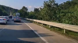Motorcycle hit by detached wheel from moving truck in Guangdong, China