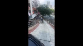 Man tumbles down stairs with motorcycle in Fujian Province, China
