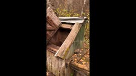 Man gets drenched after trying to drink from an old well in Yekaterinburg, Russia