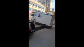 Delivery robot truck stuck midway on elevated pavement