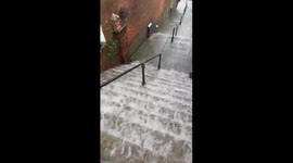 Flooded Road Causes “River Rapids” Down Set of Stairs