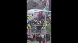 Nairobi airport closed as mourners storm onto runway to touch late PM's coffin