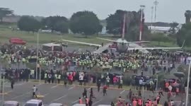 Nairobi airport in chaos as mourners storm onto runway to touch late PM's coffin