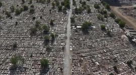 Relatives search for signs of loved ones in Syrian cemetery left in ruins by Assad regime