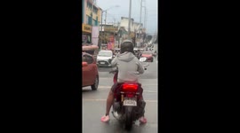 Traffic enforcer with one arm defies doubters to successfully direct cars