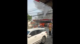 Bystanders help to tackle raging car fire at petrol station