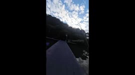 Fisherman loses catch after fish leaps back into river while being measure