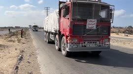Aid trucks arrive at World Central Kitchen in central Gaza following ceasefire deal
