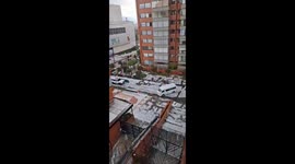 Heavy hailstorm blankets the city in a winter-like scene in Bogotá, Colombia