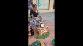Puppeteer Playing Someone Playing the Drums