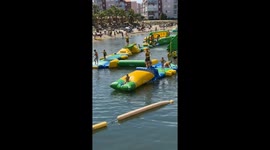 Dad Launches Daughter On Waterpark Blob