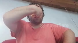 Man eats bread roll with cheese and extra hot mustard – spicy reaction!