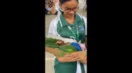 Student presents tutor with LIVE chicken and vegetables for World Teachers' Day
