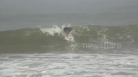 Local Namibian surfer Ripping it up during a surf contest in Swakopmund