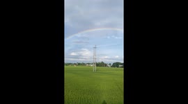 Stunning Full Rainbow Appears After Light Rain Shower