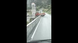 Truck crosses dangerous suspension bridge with heavy load in Sichuan, China