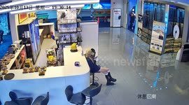 Man distracted by woman walks into sign and glass windows in Jilin, China