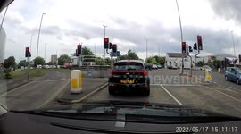 2 bike riders on stolen bikes run a red light and have a very near miss