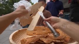 China: Street food vendor in central China goes viral for exquisite pancake art