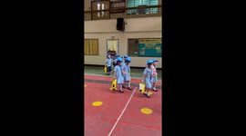 Children in the Philippines wear hard hats for earthquake drills
