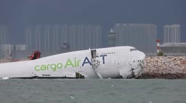 Hong Kong: Two dead after cargo plane overshoots runway at Hong Kong Airport (3)