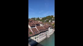 Woman enjoying slow life on balcony in Bern, Switzerland