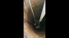 Cat stuck in 50ft deep well is rescued by firemen