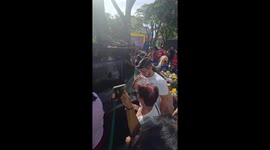 Devotees collect blessed water at José Gregorio Hernández fountain in Caracas, Venezuela