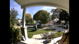 FedEx delivery driver carelessly drops heavy package onto homeowner's porch