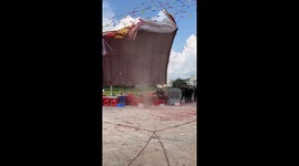 Sudden gust of wind lifts up tent at fair in China