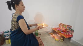 Indian families celebrate Diwali with religious displays at home