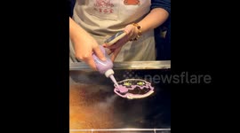 Chinese street vendor goes viral for her impressive hand-drawn cartoon pancakes