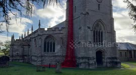 Thousands of crocheted poppies cascade from church ahead of Remembrance Day