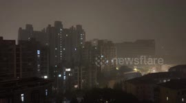 Lightning strikes building during thunderstorm in Shanghai, China