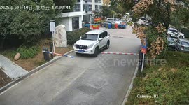 Parking gate mishap leaves SUV with unexpected dent in Anhui, China