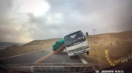 Terrifying moment truck's brakes fail on downhill slope and crashes head-on with Mercedes