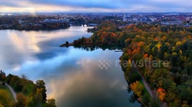 Stockholm draped in vibrant fall colors across parks and lakes