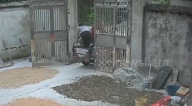 Girl falls to her knees after closing gate while standing on tricycle