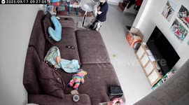 Mother instinctively protects baby when she falls from sofa