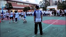 Student's hopeful long-range buzzer-beater stuns crowd at basketball match in China