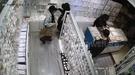 Girl sneaks necklaces in jewelry store in Sichuan Province, China