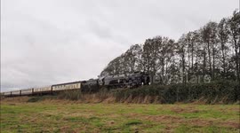 Steam train Clan Line passes through Storm Benjamin in Kent, UK